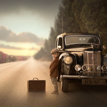 A boy with a retro car